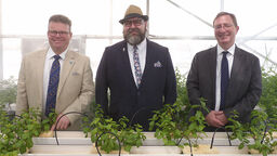 Photo of researchers at an Omani greenhouse