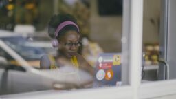 A woman on her laptop in a cafe