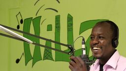 A man speaking into a microphone