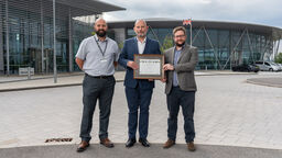 Staff received the Secured By Design award outside Factory 2050
