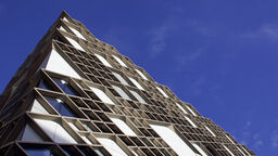 A blue sky above the University's Diamond building