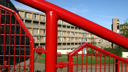 Park Hill flats in the background of a railing