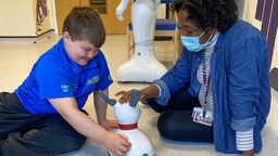 Brandon and Brenda playing with MiRo, a social robot being trialled in Sheffield Children's Hospital