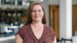 Laura Dean wearing a patterned top.