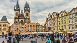 Tourists soaking up the atmosphere in the Old Town Square of Prague