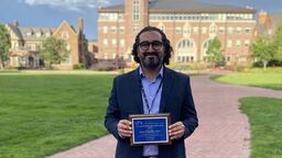 Jaime Delgadillo holding SPR award