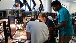 Photograph of PhD student Nathan Raj teaching at the Department's taster session for sixth form students