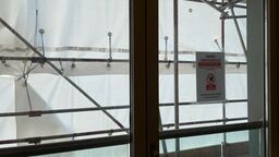 A view from behind plastic sheeting - inside a leaseholders flat undergoing cladding remediation works.
