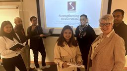 Sheffield MBA students are stood with the CEO of The Source