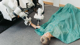 The robot medic administering an injection to a model patient