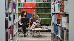 Image of two students in the Health Sciences Library