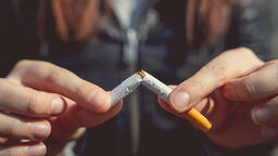 Woman breaking cigarette