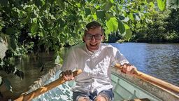 George rowing on a sunny day
