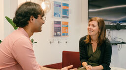 Kate Fields talking to a student.