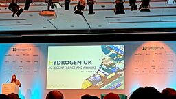 A speaker presenting at a conference.