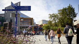 Students walking on the concourse outside of Sheffield Students' Union building