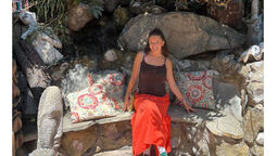 Student Grace Lenihan pictured in Canada against a woodland packdrop