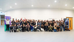 group of students in shot smiling at camera