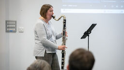 musician playing clarinet on stage