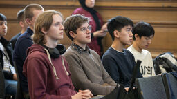 Image of students sat watching a presentation in Mappin Hall 