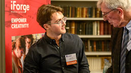 A student and a supporter having a chat