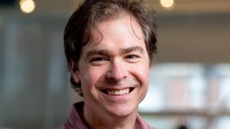 Photograph of Dr Tim Herrick smiling