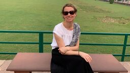 A person sitting on a bench.