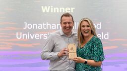 Technician receiving an award