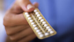 hand holding a contraception packet
