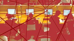 A graphic of people sitting at computers at a desk with red lines overlayed onto the image connecting at various points