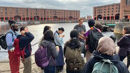 Students at the Albert Dock in Liverpool