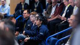 People sitting and listening to a talk