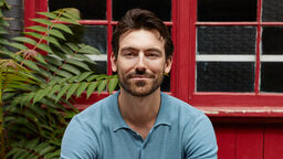 Civil engineer sitting on a bench, smiling