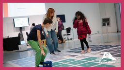 Participants on a giant board game