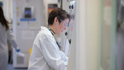 Person researching in a machine.