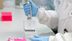 A multi channel pipette dispensing a sample into tubes