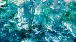 a large pile of crushed up water bottles