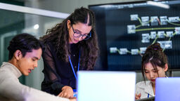 Group looks at a computer