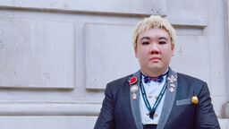 Previous student in front of the Cabinet Office