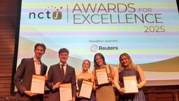 Five students stand in front of a screen which reads "NCTJ awards for Excellence"