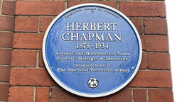 A close up shot of the blue plaque honouring Herbert Chapman at the University of Sheffield
