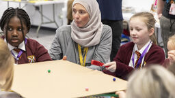 Dr Alison Buxton from the University of Sheffield helping primary school children learn about fusion energy