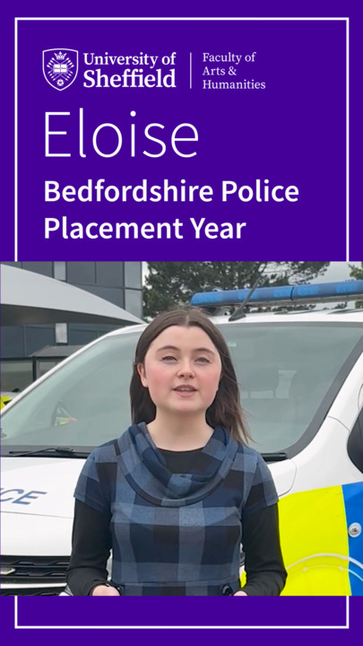Eloise in front of a Police Van